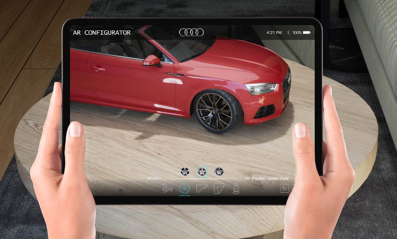 Configuratore di realtà aumentata mostrato su un tablet, con il particolare di un'Audi decappottabile rossa